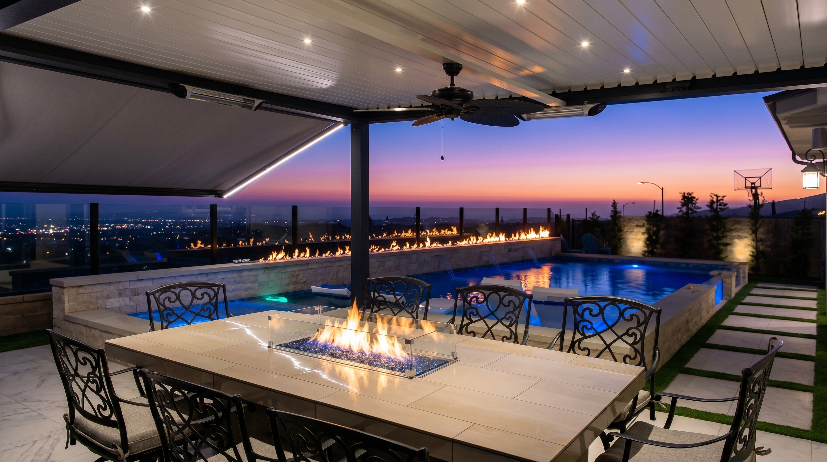 Pool with fire features and sunset view